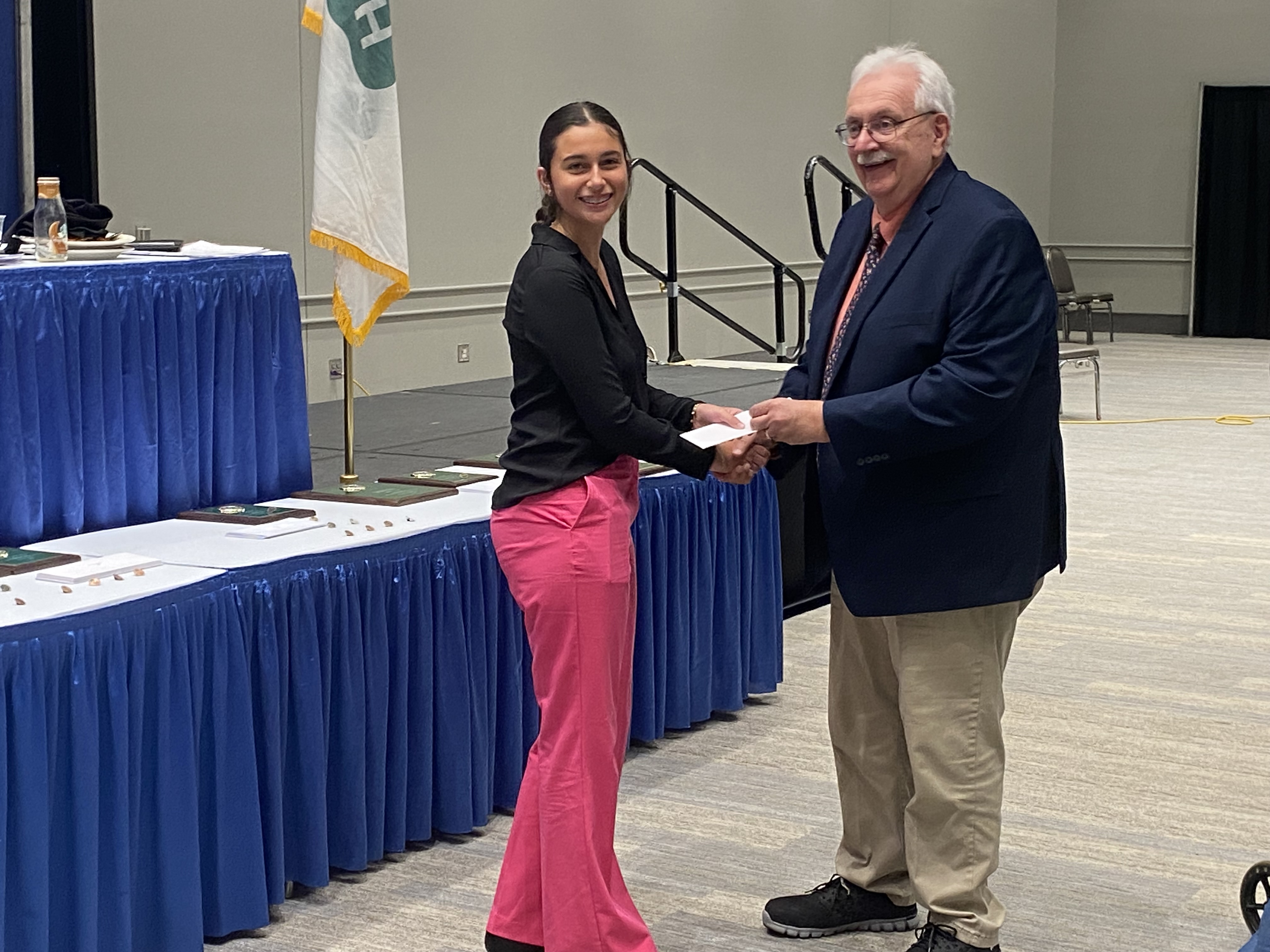 girl receiving award